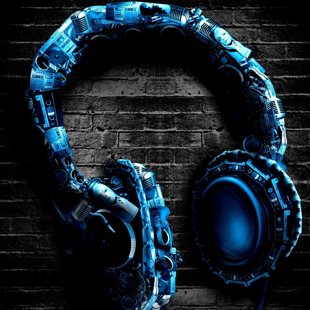 Blue stylish headphones on brick background