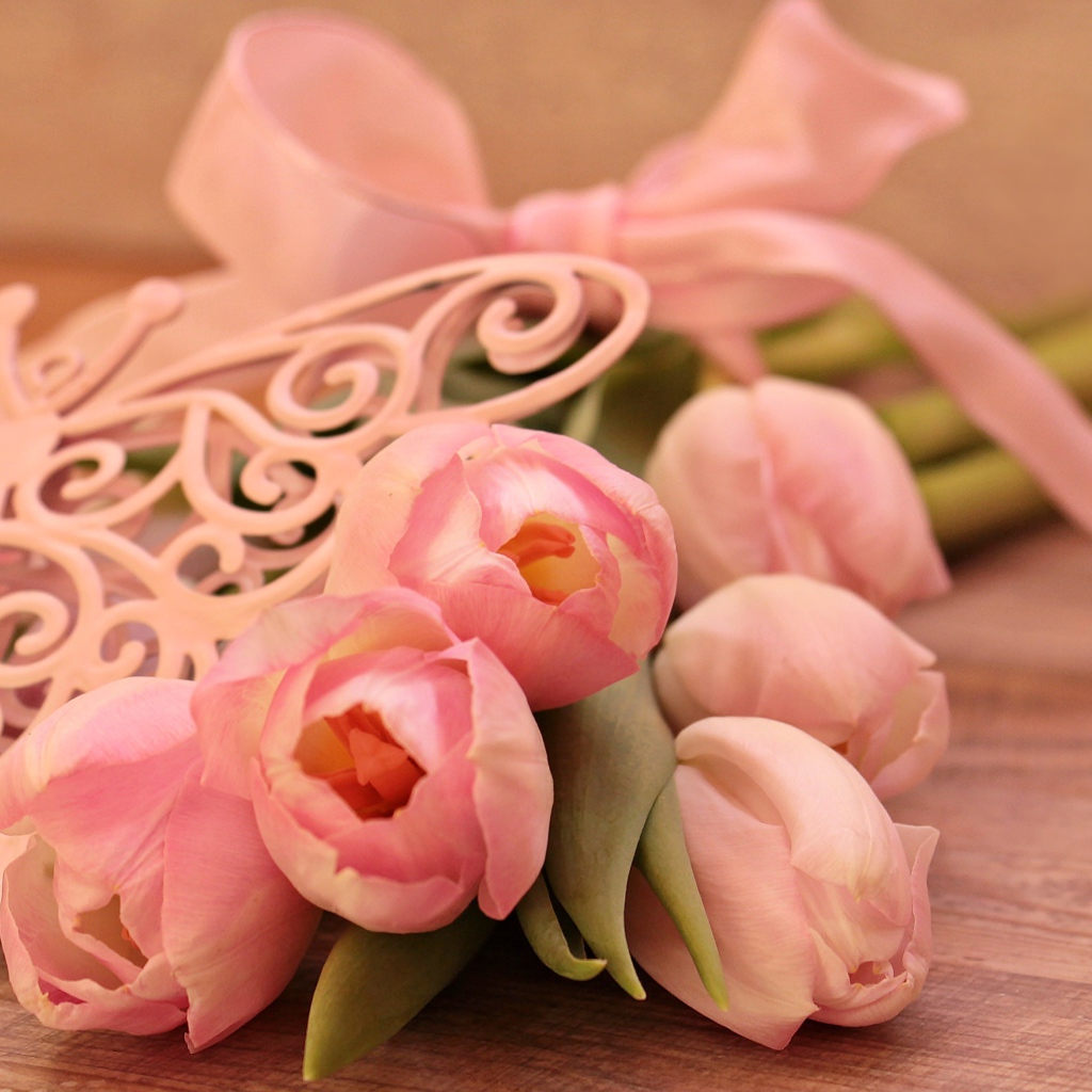Bouquet of pink tulips with ribbon and butterfly