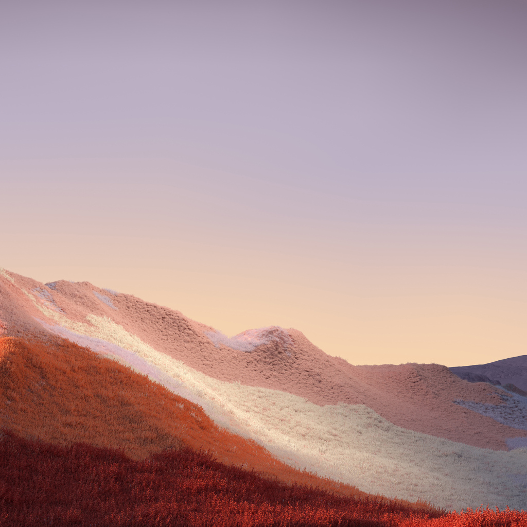 Покрытые травой горы на фоне неба