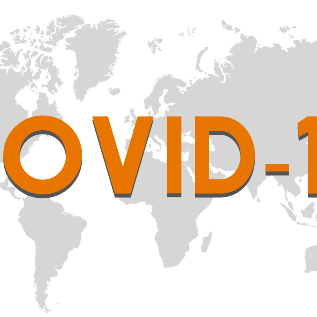 Большая надпись COVID 19 на фоне карты 