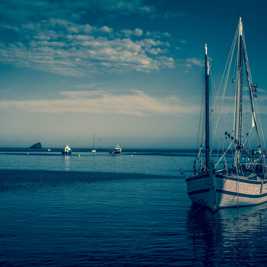 Sailing boat in the port at dusk