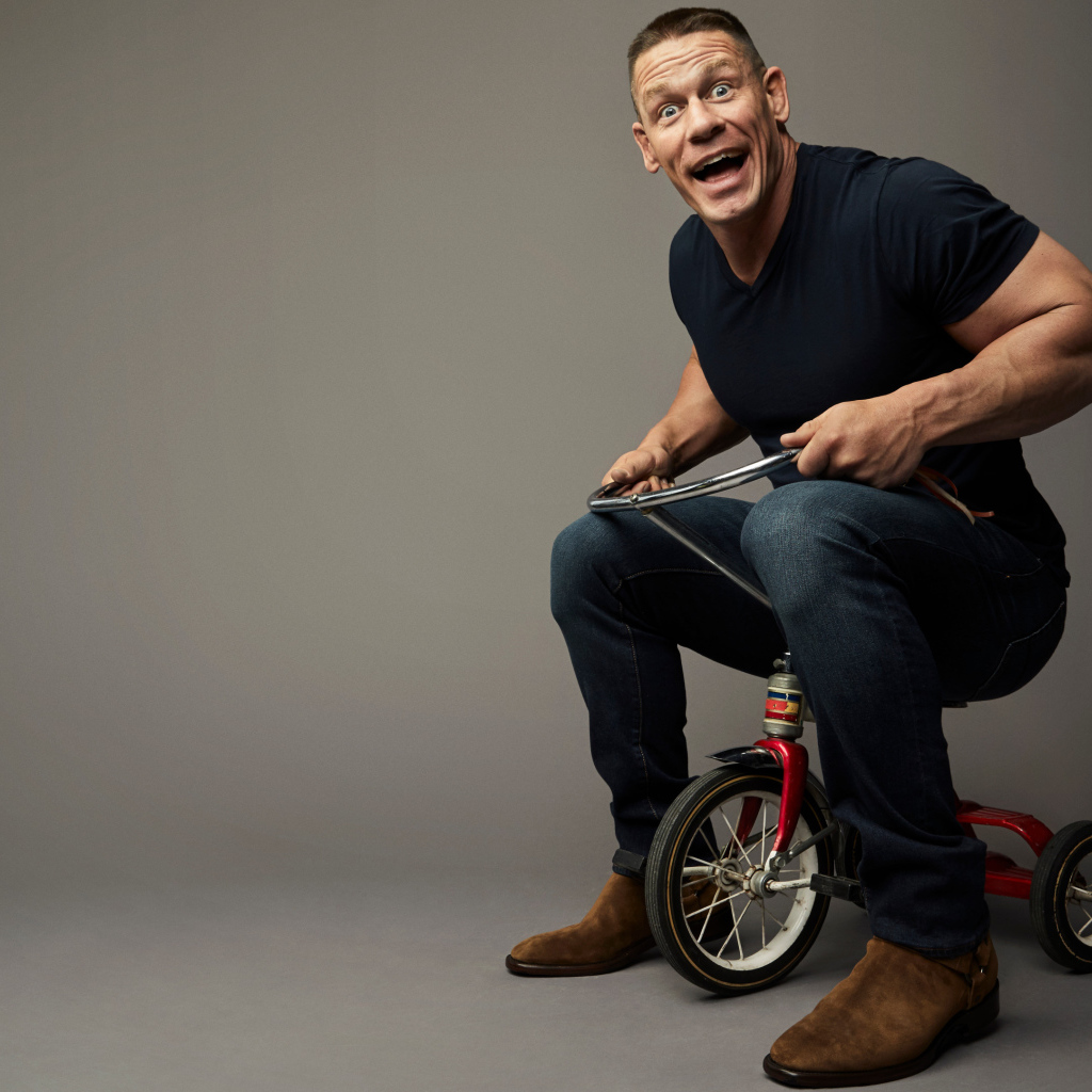 American wrestler John Cena on a children's bike