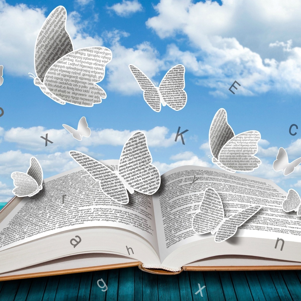 Бумажные бабочки и буквы над книгой 