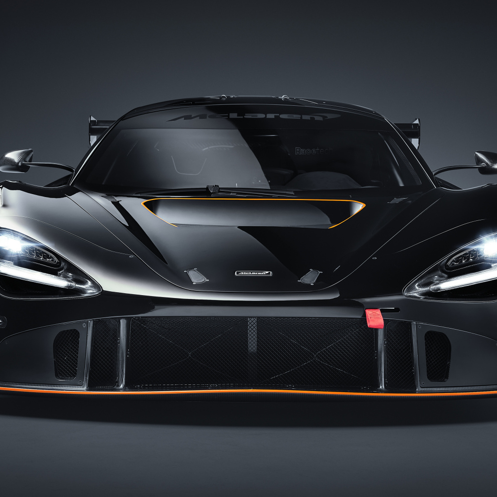 Автомобиль McLaren 720S GT3X 2021 года вид спереди на сером фоне