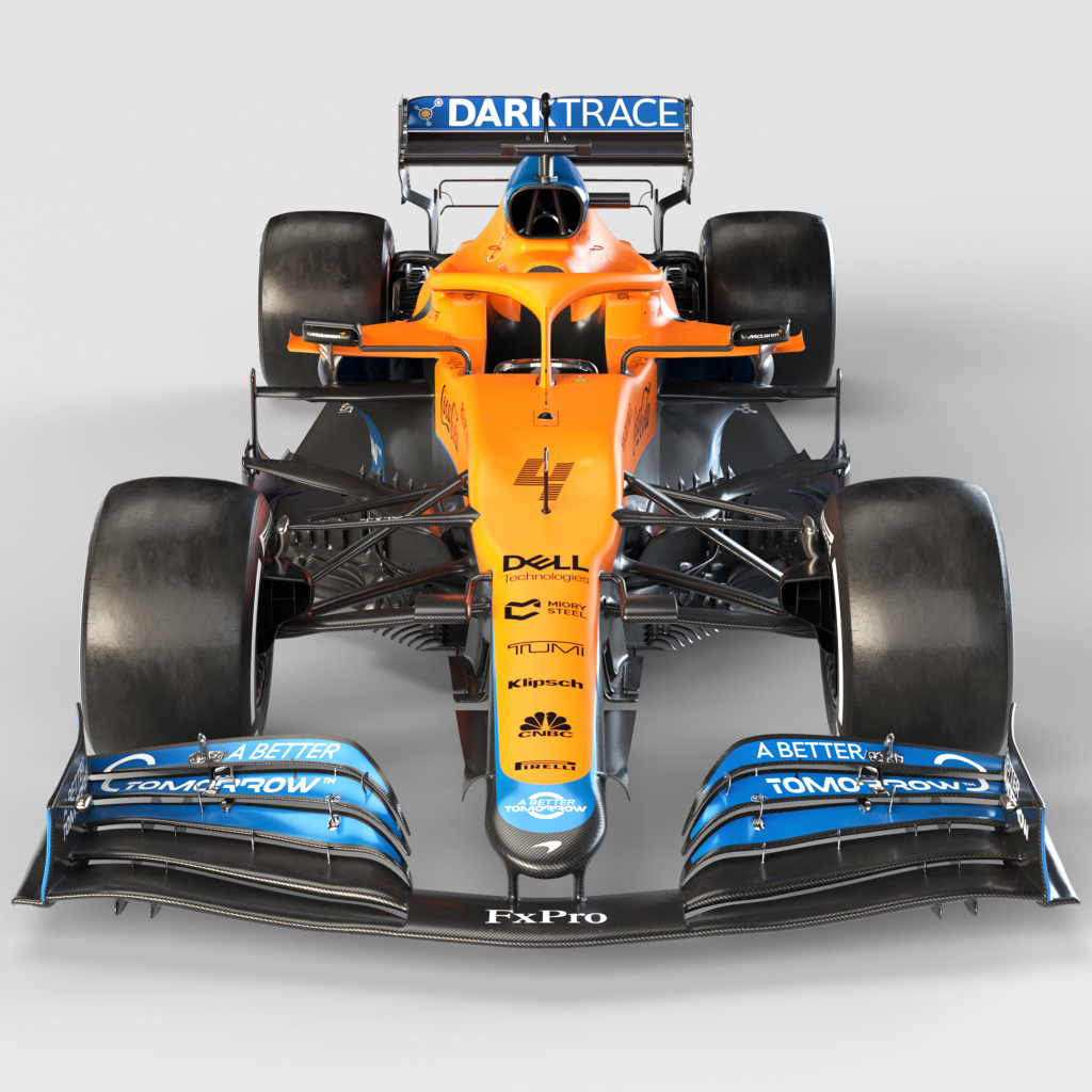 Гоночный автомобиль McLaren MCL35M 2021 года на сером фоне