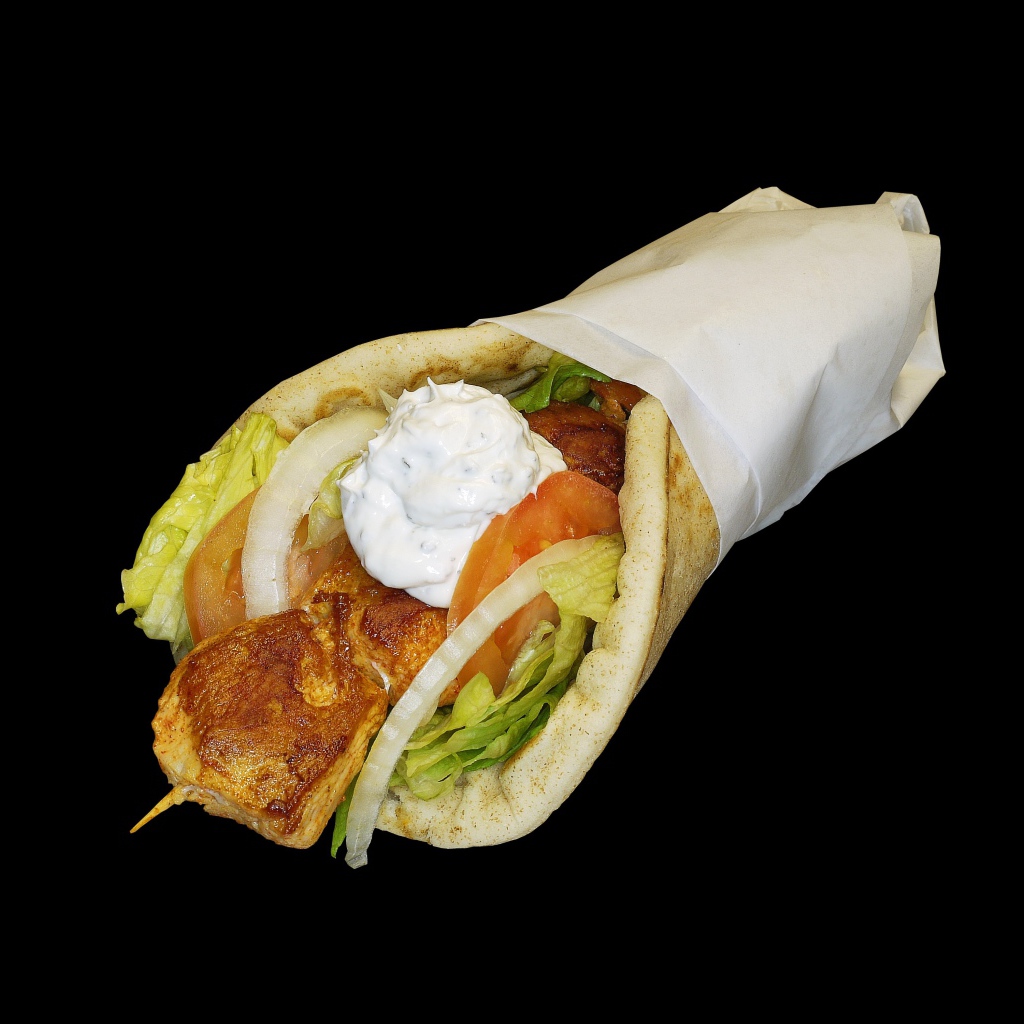 Шаурма в лепешке на черном фоне