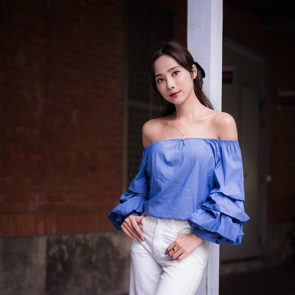 Asian girl in white pants at home