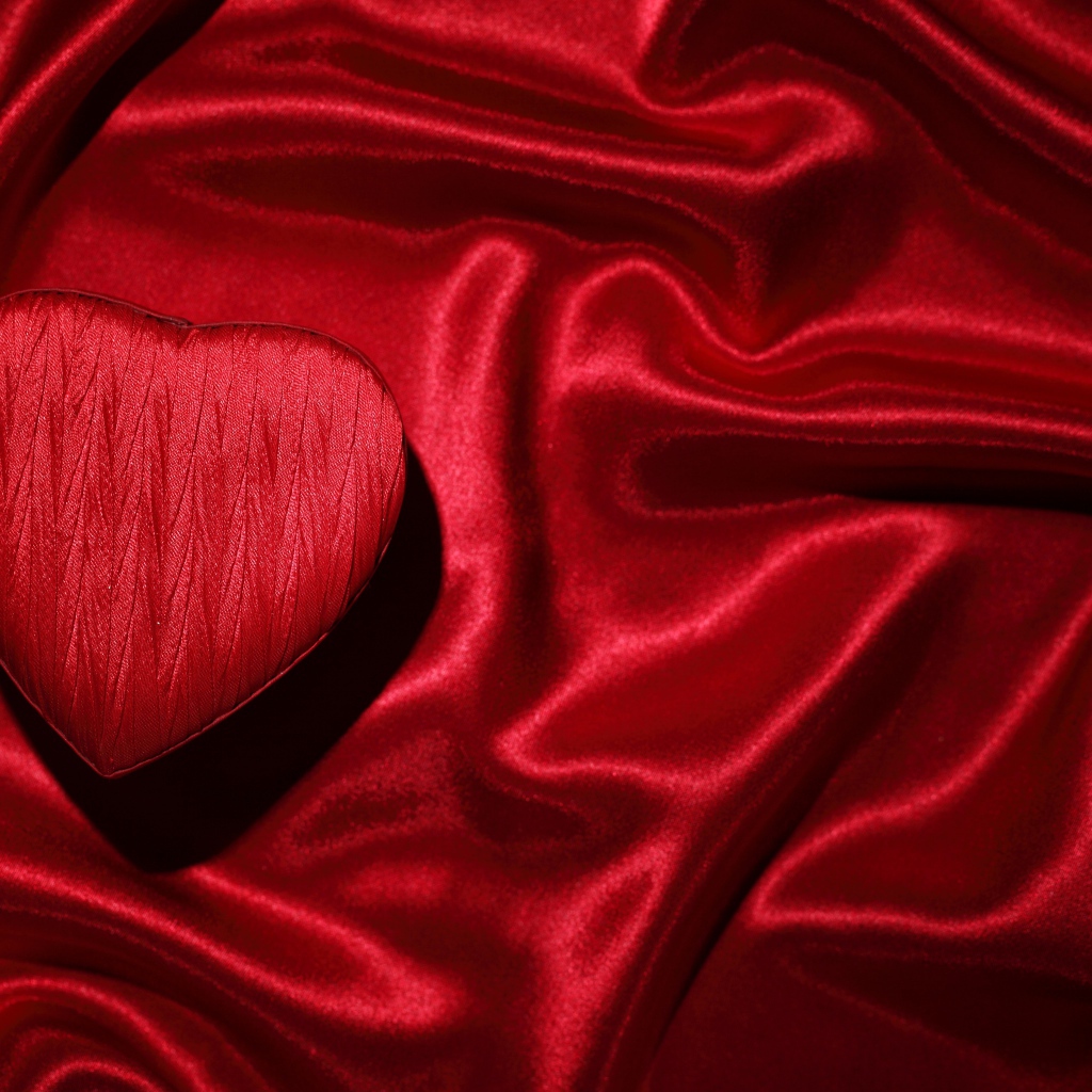 Red satin fabric and heart