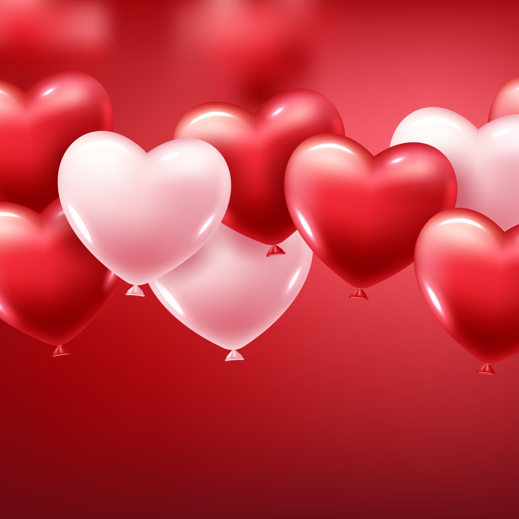 Белые и красные шарики в форме сердца на красном фоне
