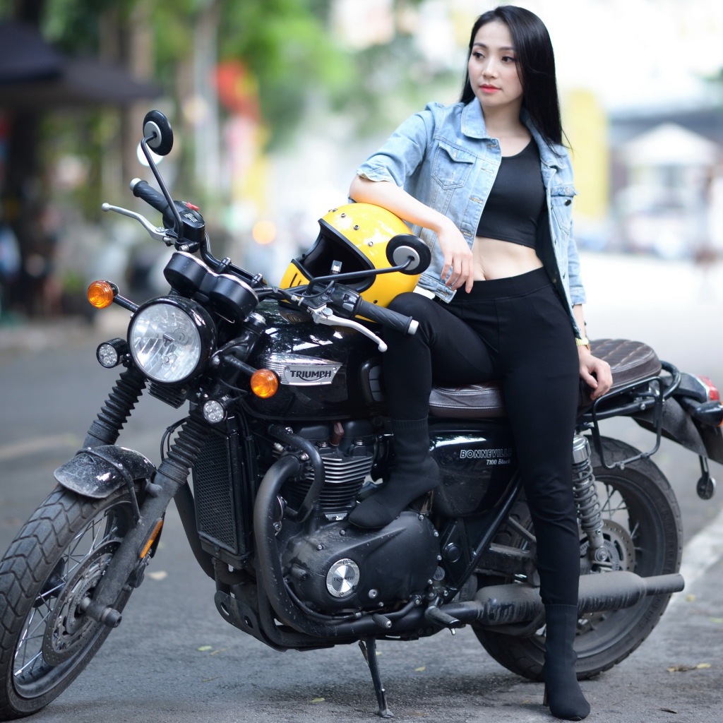 Beautiful asian girl on a motorcycle