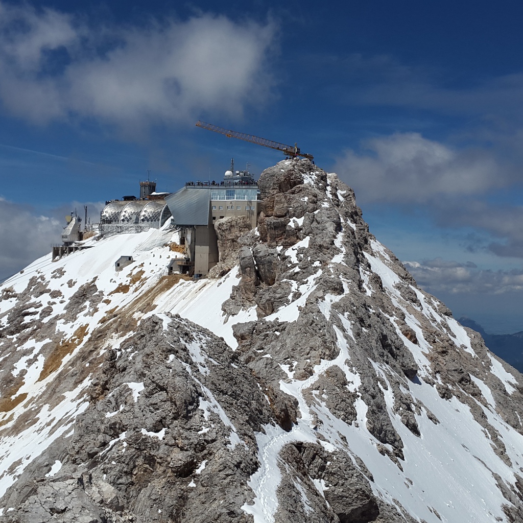 Zugspitze peak in snow under blue sky