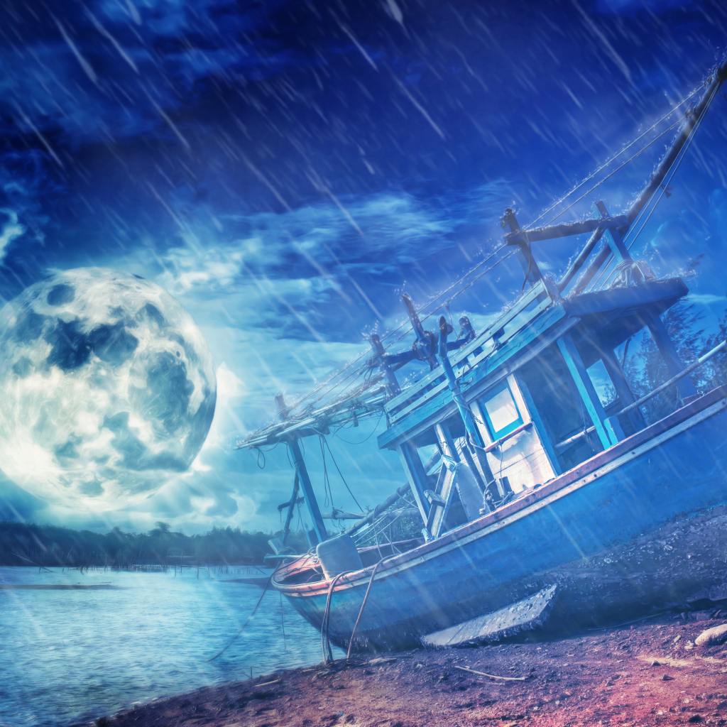 Old boat on the shore in the light of the moon in the rain