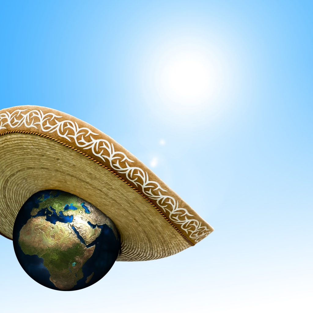 Планета земля в сомбреро на голубом фоне