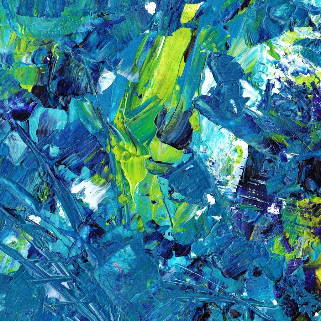 Синие и желтые краски смешанные на палитре