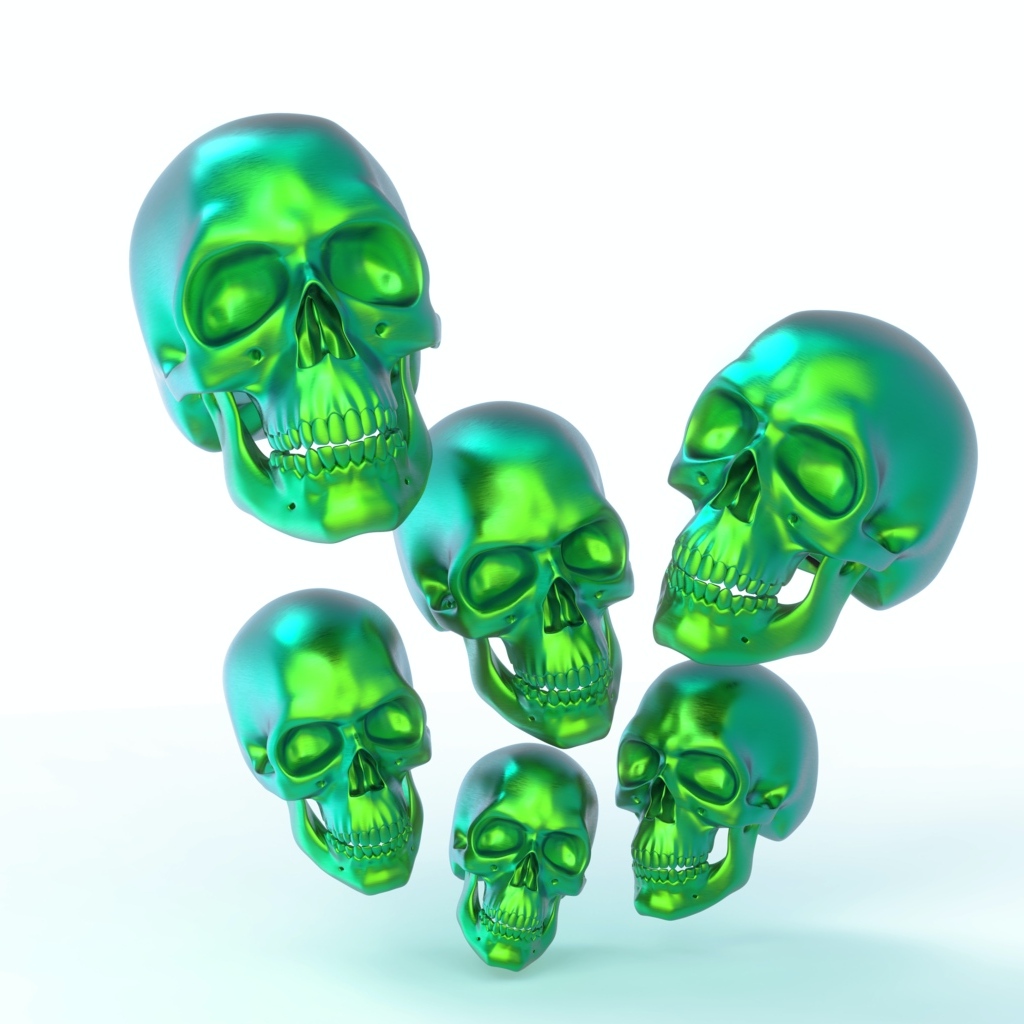 Зеленые стальные черепа на белом фоне