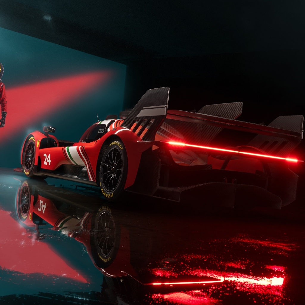 Красный спортивный автомобиль Ferrari 499P Modificata готовится к гонке