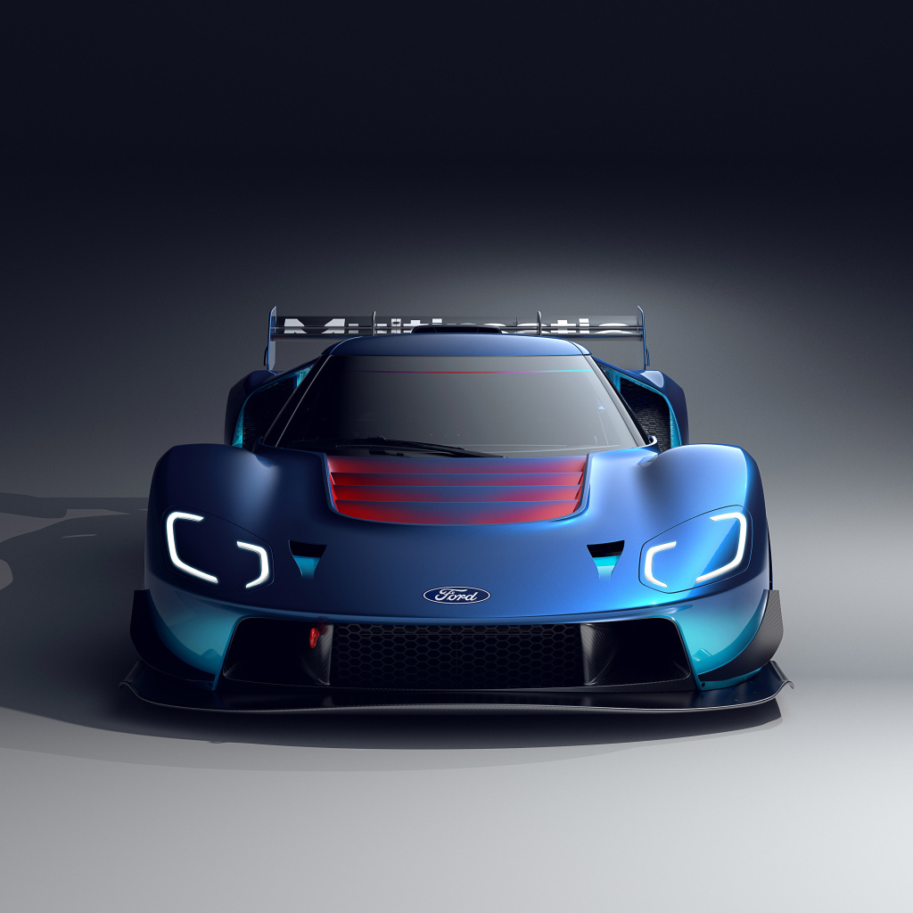 Синий автомобиль Ford GT MkIV 2023 на сером фоне