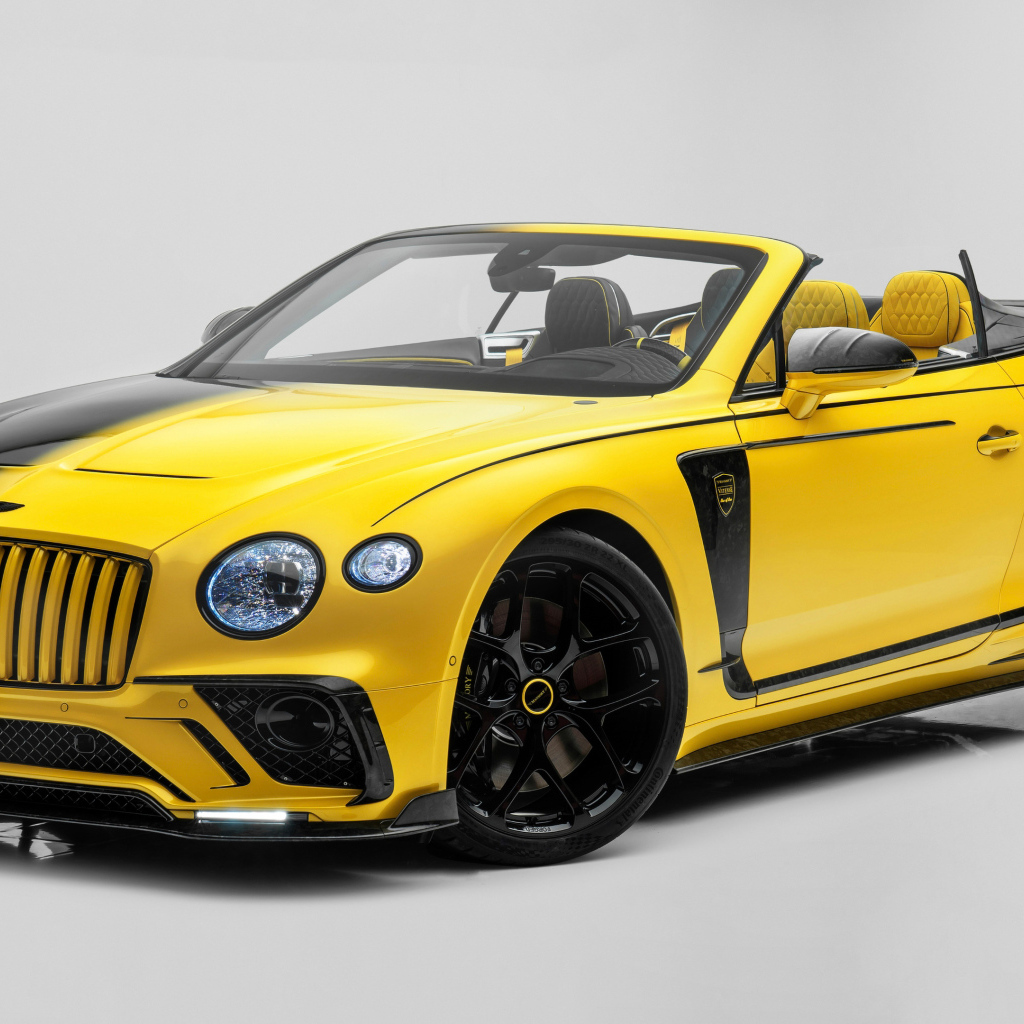 Автомобиль Mansory Vitesse Continental GTC 2022 на сером фоне