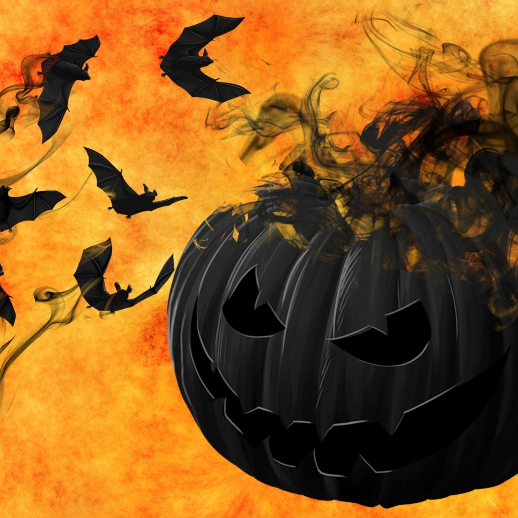 Черные летучие мыши с тыквой на оранжевом фоне
