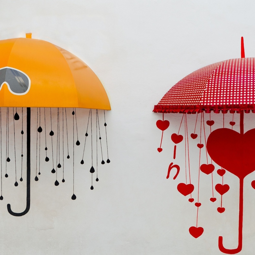 Два нарисованных зонта на серой поверхности