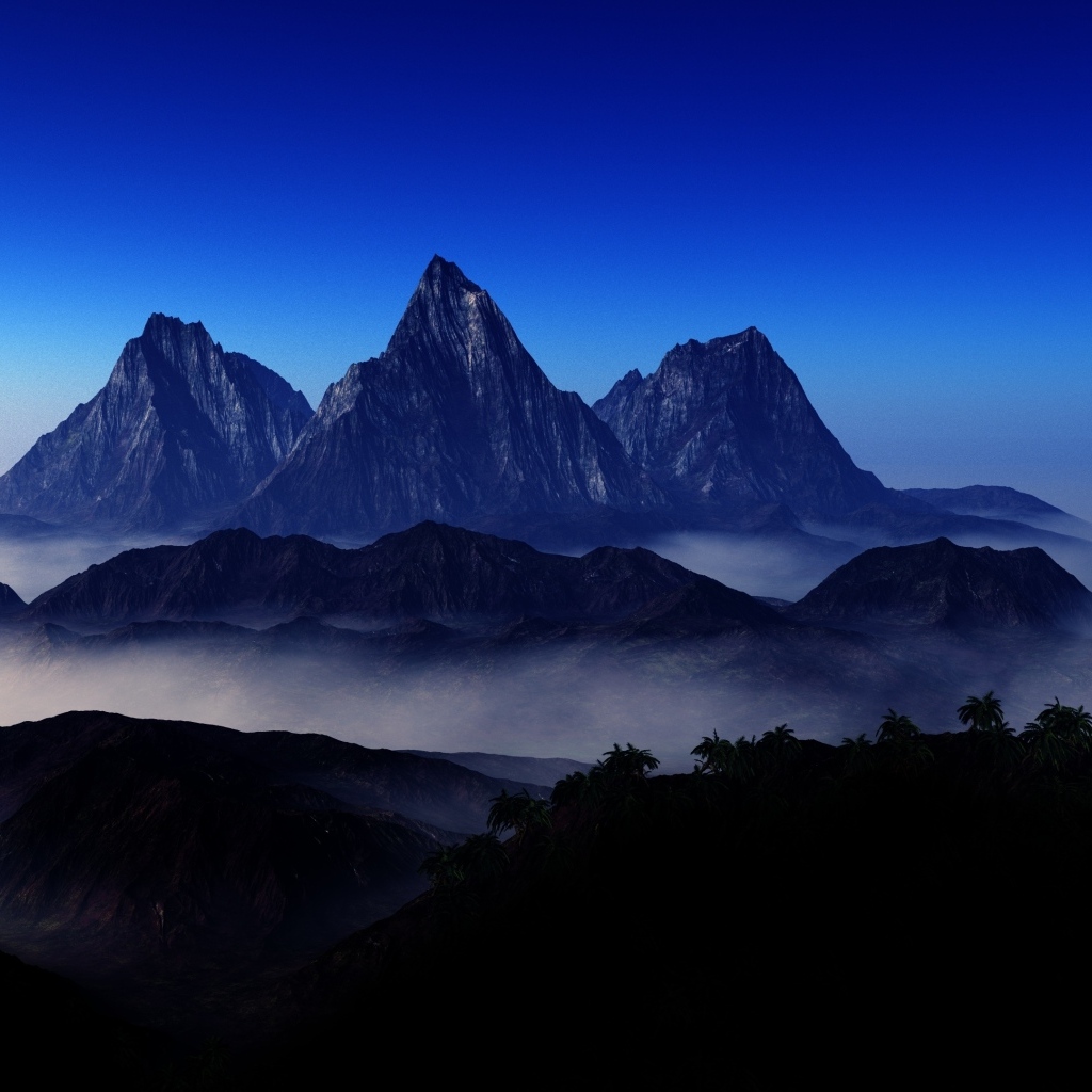 Три горные вершине в тумане