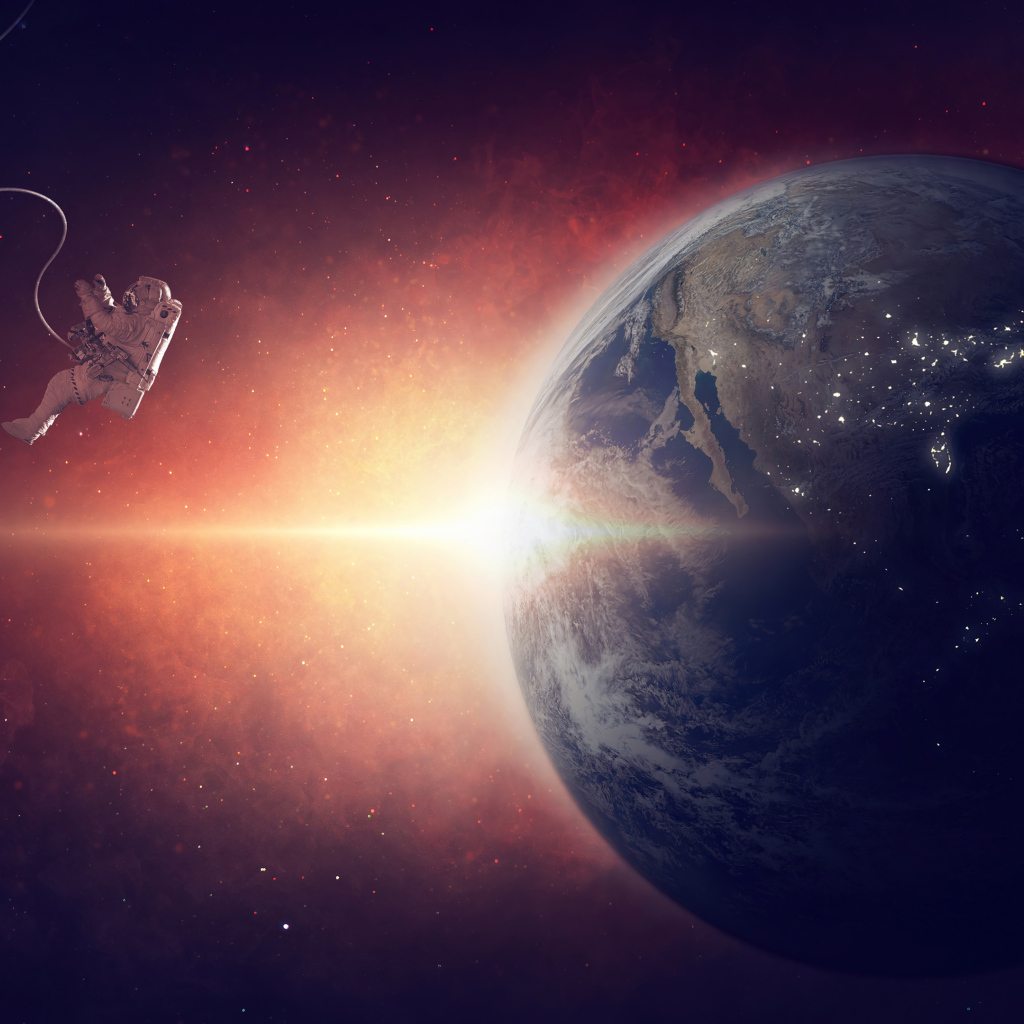 Астронавт в открытом космосе на фоне планеты земля