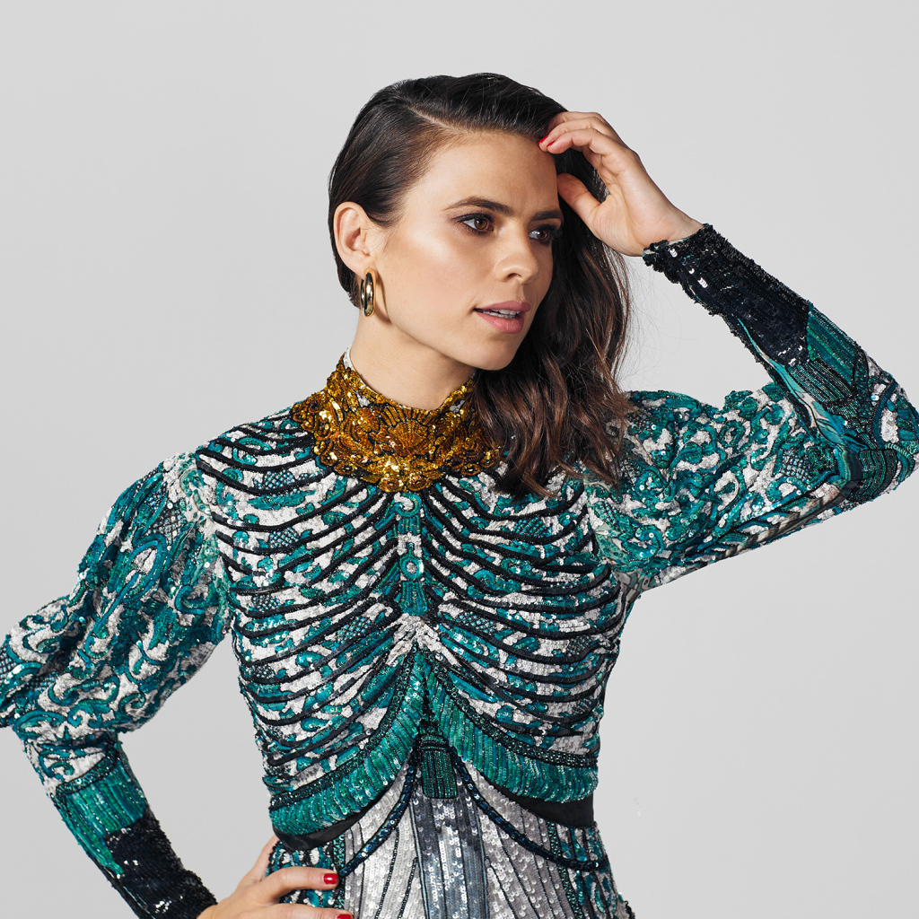 Actress Hayley Atwell in a beautiful dress on a gray background