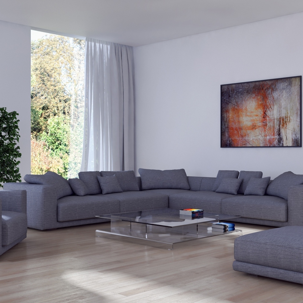 Большой серый диван в гостиной комнате