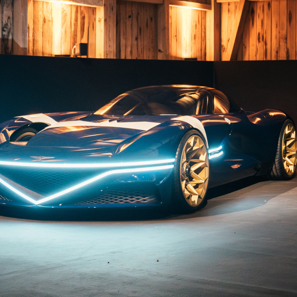 Автомобиль Genesis X Gran Berlinetta Tribute 2024 года с включенными фарами