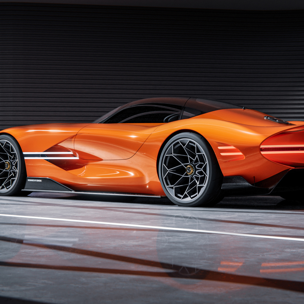 Вид сзади на оранжевый автомобиль концепт Genesis X Gran Berlinetta