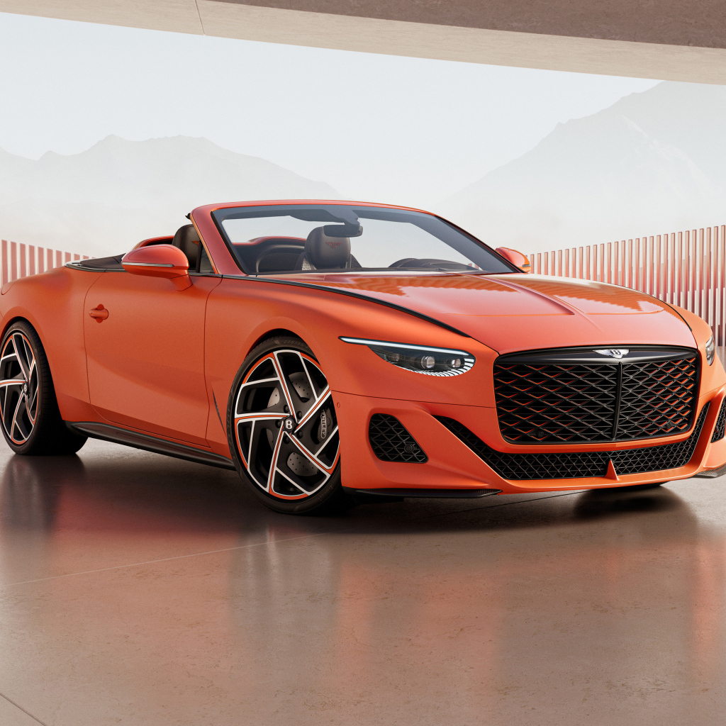 Красный автомобиль Bentley Mulliner Batur Convertible 2024 года