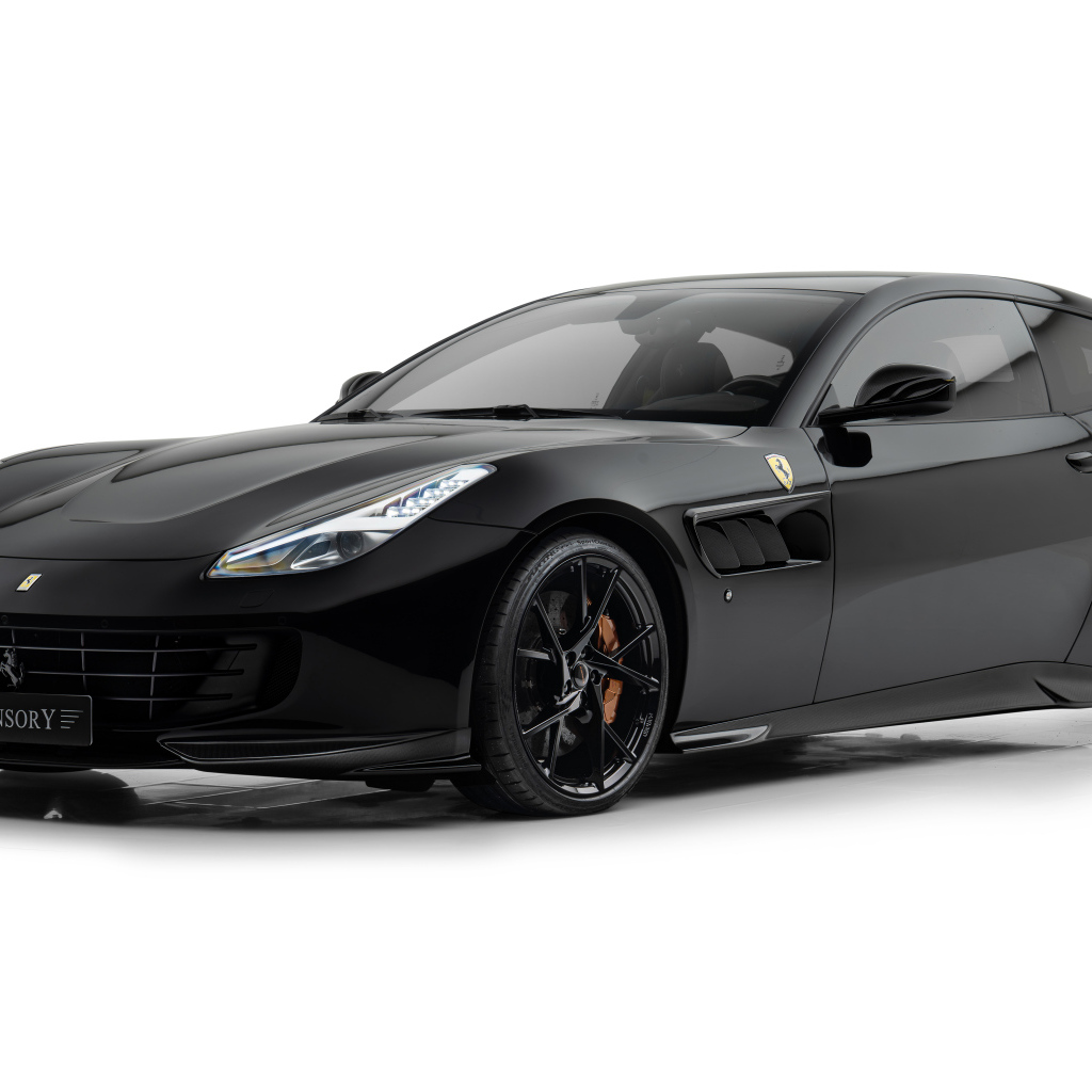 Черный автомобиль Mansory Ferrari GTC4Lusso 2024 года на белом фоне