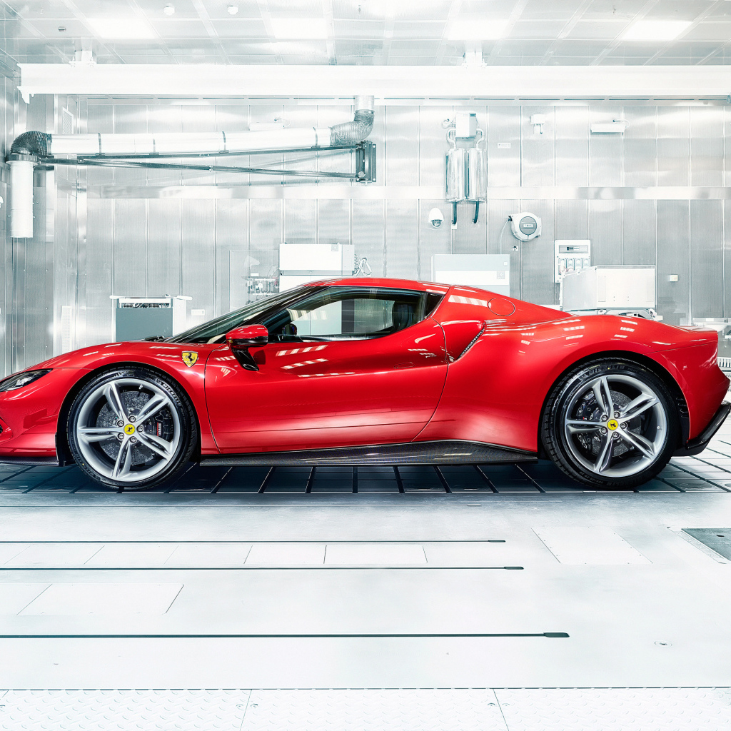 Красный автомобиль Ferrari 296 GTB в гараже