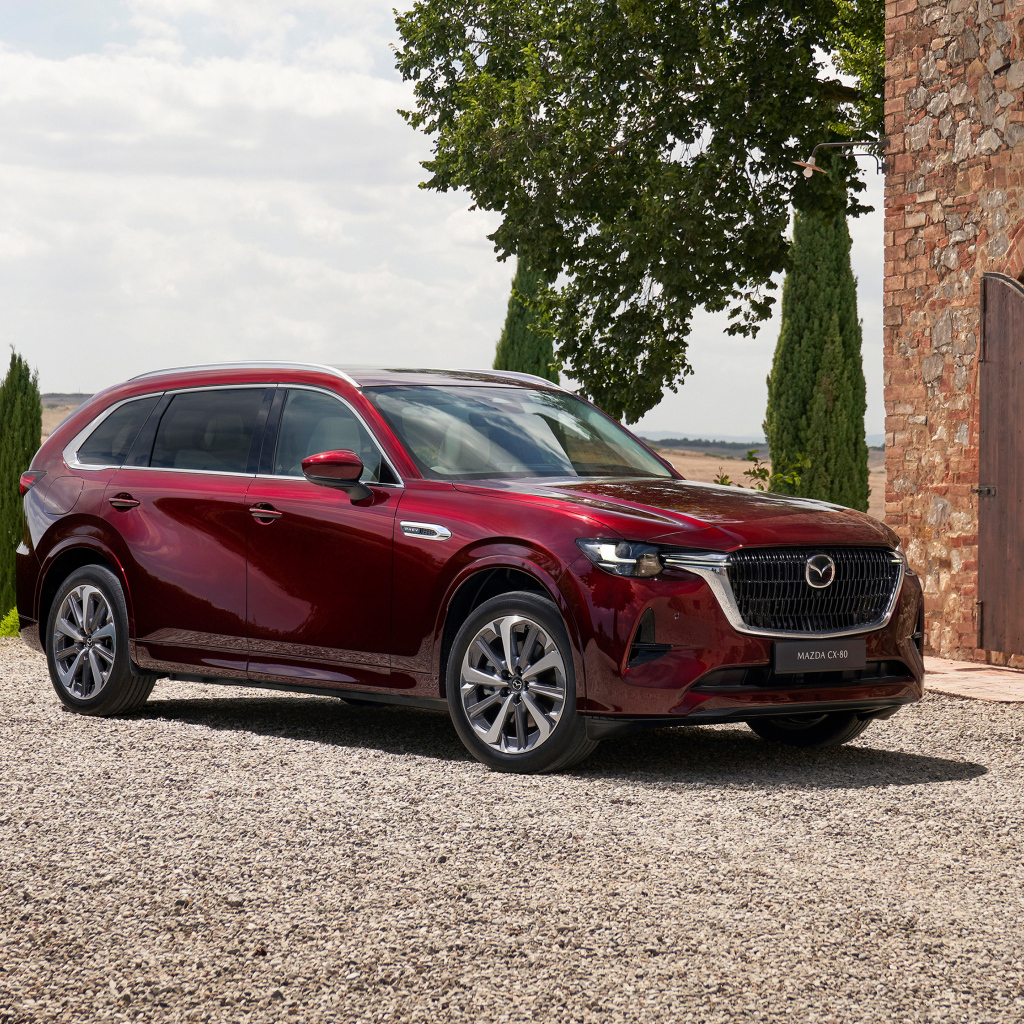 Бордовый автомобиль  Mazda CX-80 E-Skyactiv PHEV AWD 2024 года
