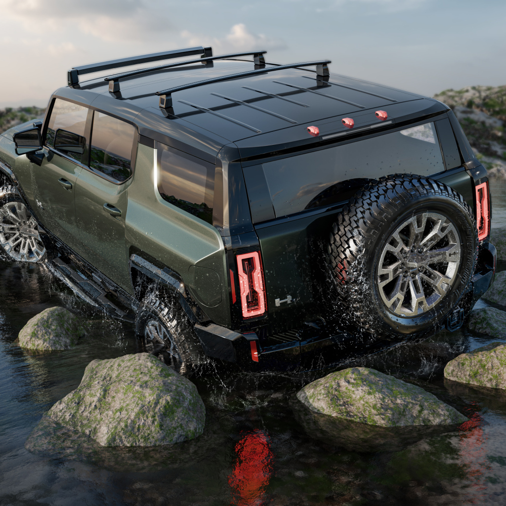 Внедорожник GMC Hummer EV Pickup 2024 года едет по камням
