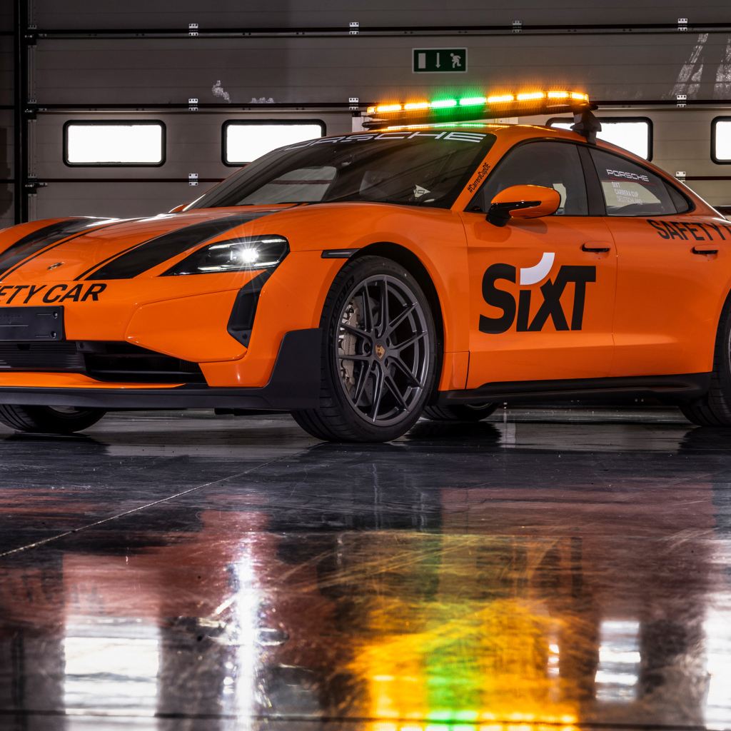 Оранжевый автомобиль Porsche Taycan Turbo GT SIXT Carrera Cup Deutschland Safety Car 2024 года