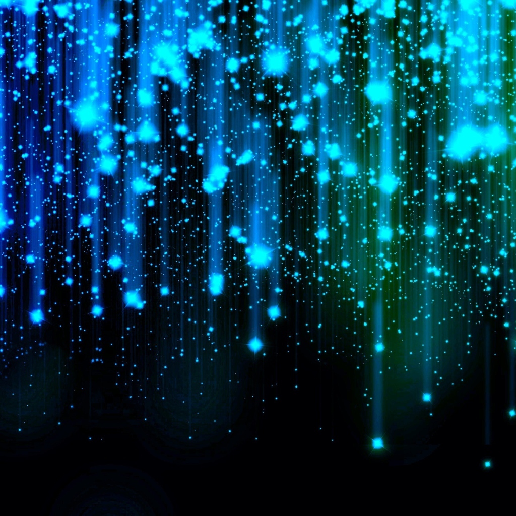 Яркие искры летят вниз на черном фоне