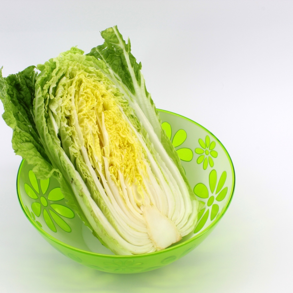 Beijing cabbage in a bowl on a gray background