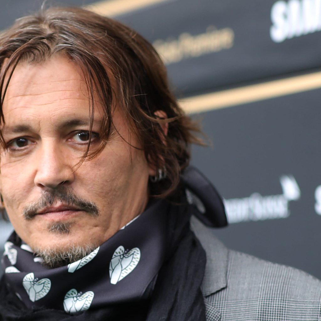 Actor Johnny Depp with a scarf around his neck