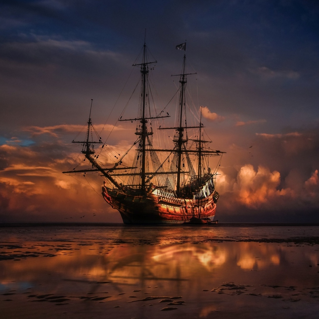 Большой корабль идет на мель на закате