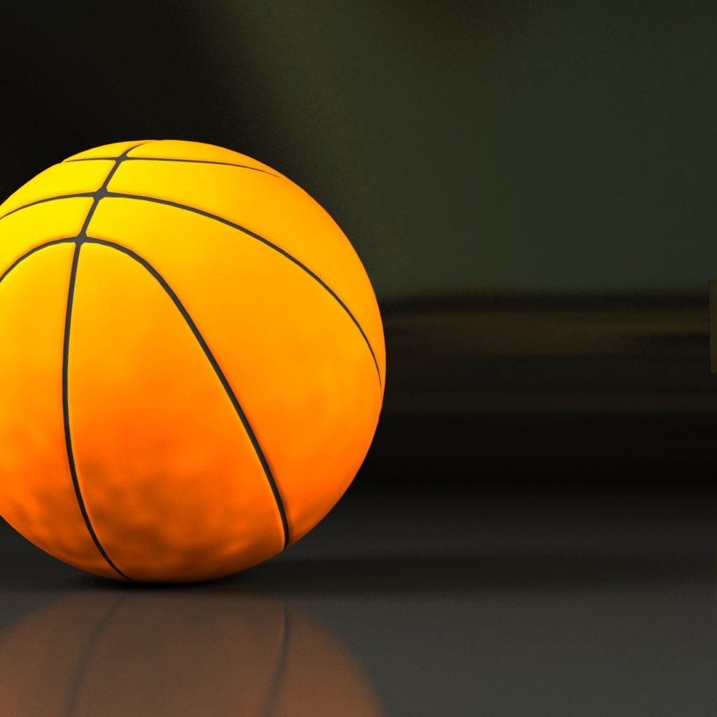 Большой оранжевый мяч на сером фоне