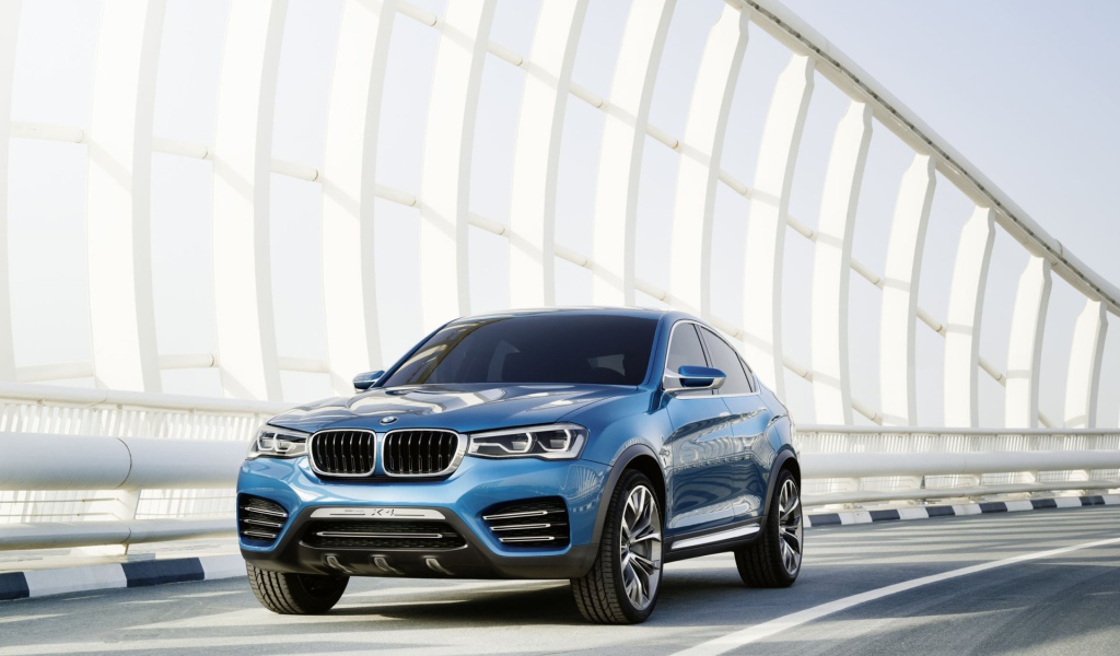 The blue BMW X4 crossover on the road