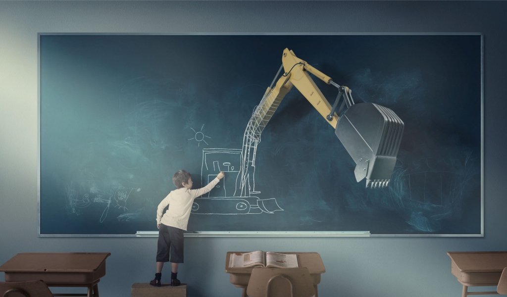 Мальчик рисует экскаватор