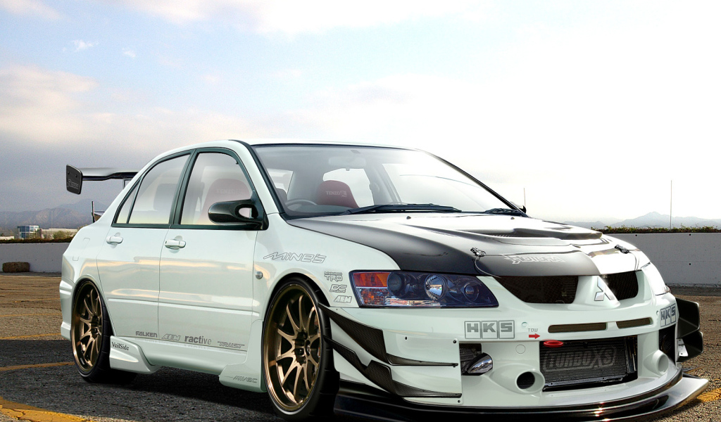 Автомобиль Mitsubishi Lancer Evolution на дороге