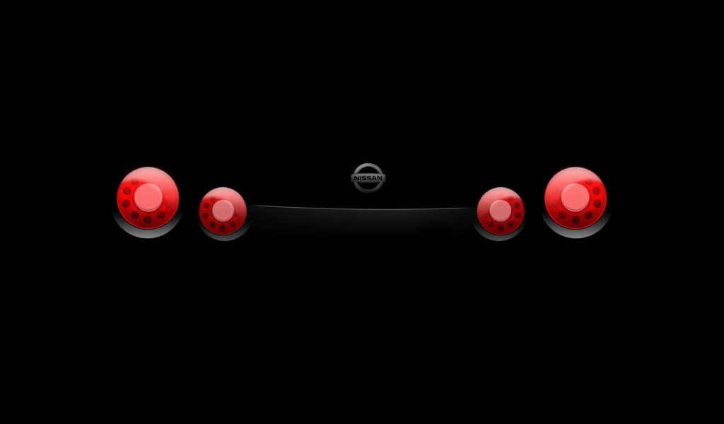 Стоп сигналы автомобиля на черных обоях