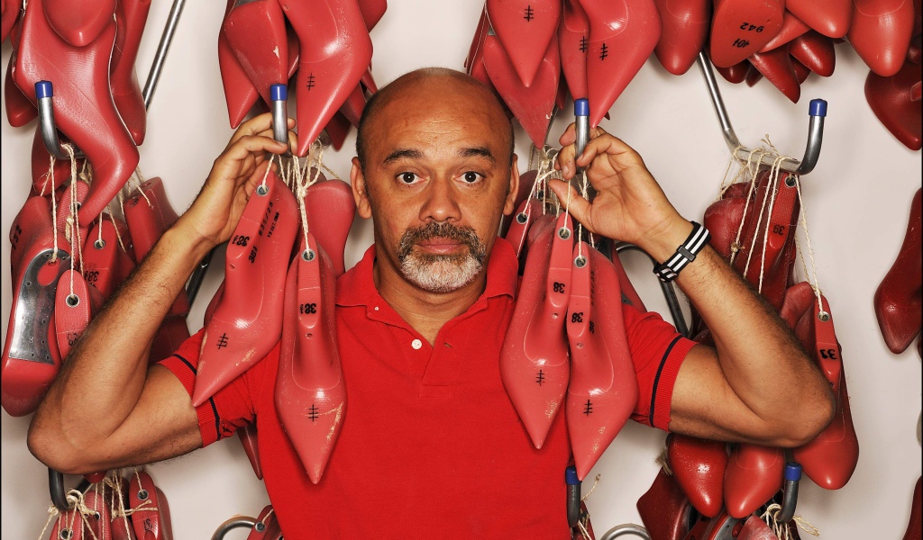 Известный модельер Christian Louboutin