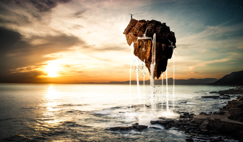 Человек стоит на скале