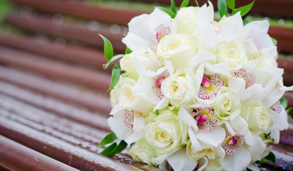 White roses and other flowers in a wedding bouquet