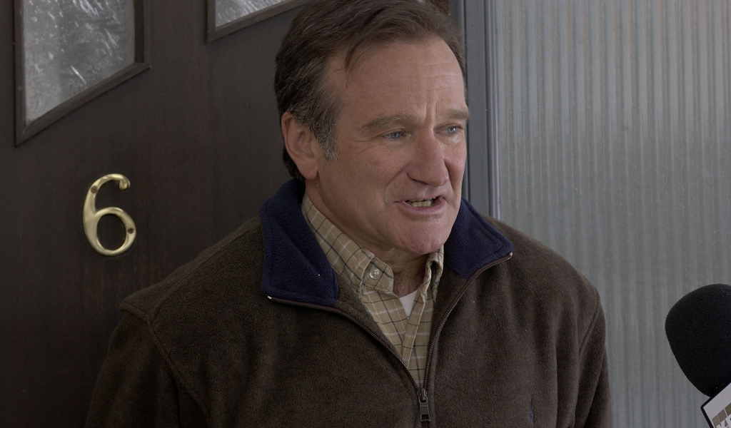 Актер Робин Уильямс у двери