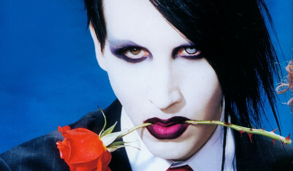 Marilyn Manson with a rose in his teeth
